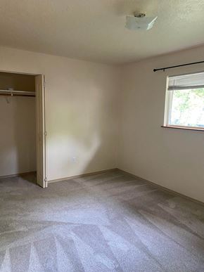 Sandpoint house for rent - an empty room with a window and a door