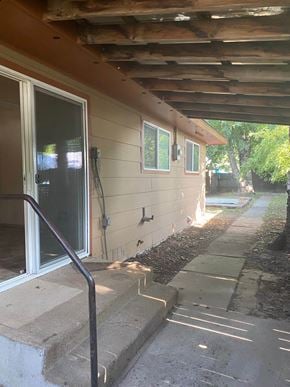 Sandpoint house for rent - a view of the outside of a house with a ramp and a door