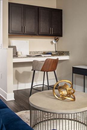 Omaha apartment for rent - a kitchen with a bar and a chair and a table