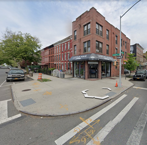 Brooklyn apartment for rent - A street view of a crosswalk with a building in the background.