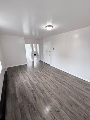 Brooklyn apartment for rent - A room with wooden flooring and white walls.