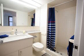 Brooklyn apartment for rent - a bathroom with a toilet and a sink and a shower