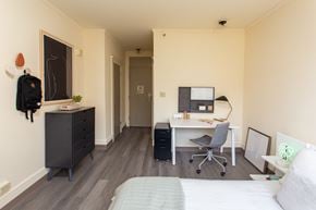 Brooklyn apartment for rent - a bedroom with a bed and a desk with a chair