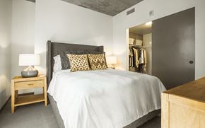 Portland apartment for rent - Bedroom with white walls and large closet at Block 17 Apartments in the Pearl District in Portland, Oregon.