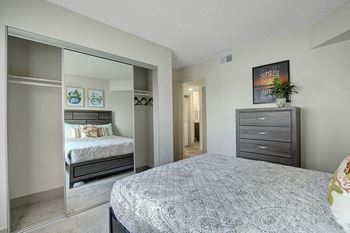Beautiful bright bedroom with wide windows