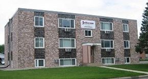 Alexandria apartment for rent - a brick building with a sign on the side of it