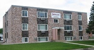 Alexandria apartment for rent - a brick building with a sign on the side of it