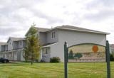 Howard Lake apartment for rent - a large white house with a sign in front of it