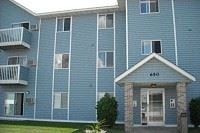 Howard Lake apartment for rent - a blue apartment building with a porch and a door