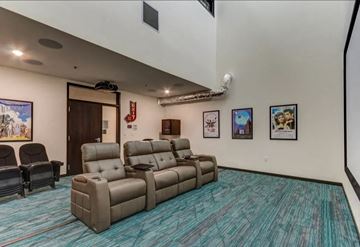 Grand Forks apartment for rent - a living room with couches and chairs and a blue carpet