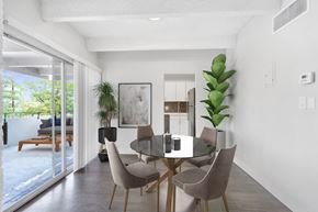 Denver apartment for rent - a dining room with a glass table and chairs