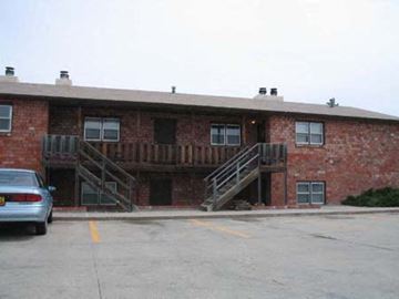 Kearney apartment for rent - a red brick building with two sets of stairs