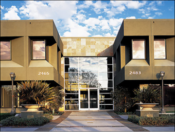 Palo Alto apartment for rent - The building has a modern design with a glass entrance.