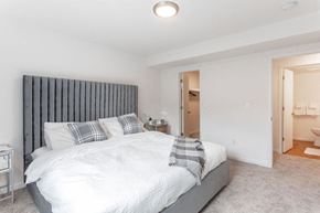 Inkster apartment for rent - the master bedroom has a large bed and a bathroom