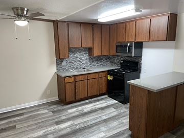 Sun Valley apartment for rent - a kitchen with wooden cabinets and a stove and a sink