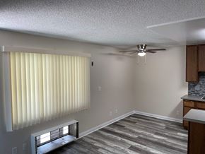 Sun Valley apartment for rent - a living room with a window and a ceiling fan