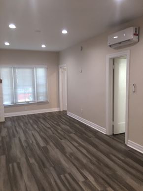 Glendale apartment for rent - an empty living room with wooden floors and a window