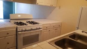 San Diego apartment for rent - a kitchen with a stove and a sink