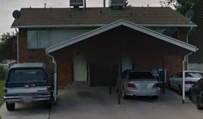 West Valley City apartment for rent - A house with a car parked in front of it.