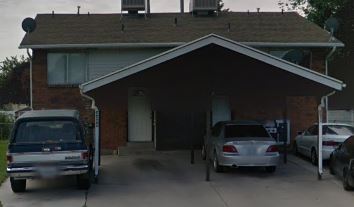 West Valley City apartment for rent - A house with a car parked in front of it.