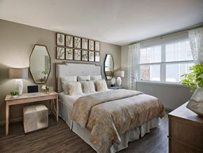 Trumbull apartment for rent - a bedroom with a bed and a desk and a window