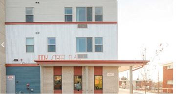 Lakewood apartment for rent - The front of a building with the number 1440 on it.