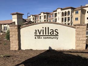 Yucaipa apartment for rent - the villas at 565 community sign in front of buildings