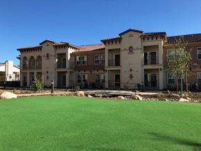 Yucaipa apartment for rent - a large lawn in front of a building