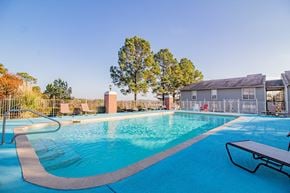 Maumelle apartment for rent - a swimming pool with a house in the background