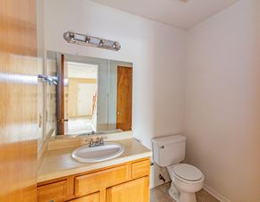 Little Rock townhouse for rent - a bathroom with a sink toilet and a mirror