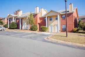 Little Rock townhouse for rent - an empty parking lot in front of an apartment building
