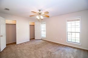 Maumelle apartment for rent - an empty living room with a ceiling fan and a closet