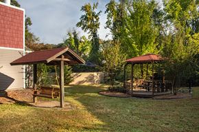 North Little Rock apartment for rent - a backyard with a gazebo and a swing set