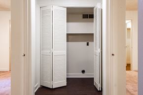North Little Rock apartment for rent - a closet with white shutters in a living room