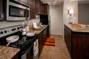 Davis apartment for rent - a kitchen with a stove and a microwave
