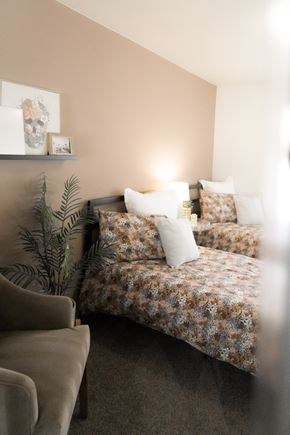 Davis apartment for rent - Image of a bedroom with a pink wall and two beds