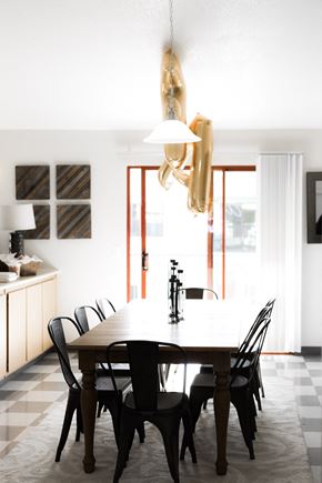 Davis apartment for rent - Dining room table and chairs with gold letter A and F balloon floating above