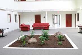 Davis apartment for rent - The Atriums study lounge with natural lighting, seating, and tables