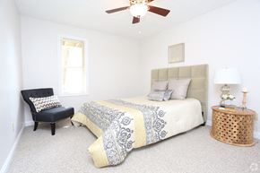 Lexington apartment for rent - a bedroom with a bed and a ceiling fan