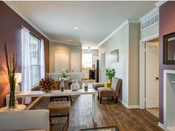 Dallas apartment for rent - a living room and dining room with a table and chairs