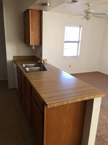 Snyder house for rent - a kitchen with a wooden counter top and a sink
