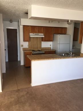 Snyder house for rent - an empty kitchen with a white counter top