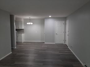 Hartland apartment for rent - A room with a white door and a chandelier.