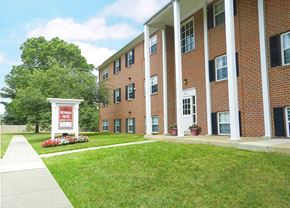 Essex apartment for rent - a large brick building with a sign in front of it