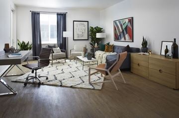 San Jose apartment for rent - a living room with a couch and chairs and a rug