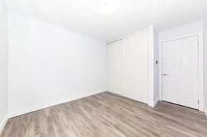 Oshawa apartment for rent - an empty room with white walls and a white door