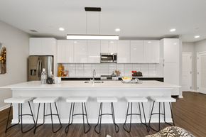 Wynnewood apartment for rent - Huge apartment kitchen with white cabinetry, breakfast bar, and stainless steel appliances