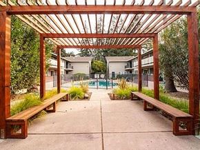 Mountain View apartment for rent - a covered area with benches and a swimming pool