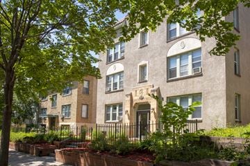 Minneapolis apartment for rent - exterior view of a brick apartment building with trees