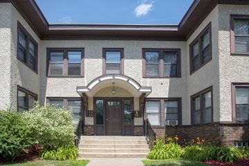 Minneapolis apartment for rent - the front of a building with steps and a door